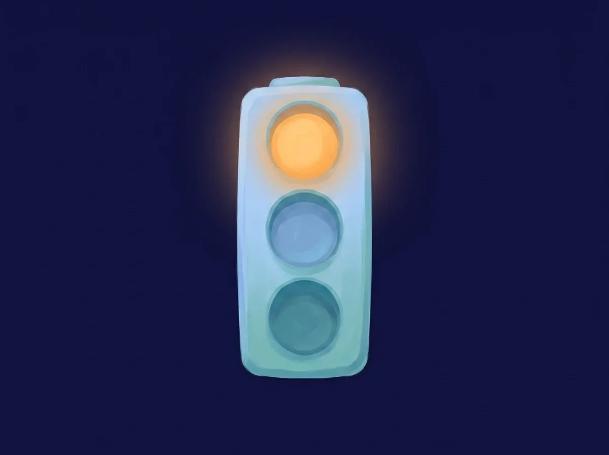 A traffic light with its top lamp lit — the kind of everyday moment a check can be tied to